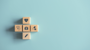 5 wooden cubes with medical icons on it