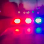 a blurry image depicing red and blue police lights