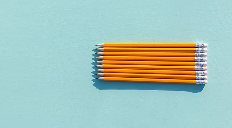 9 pencils lined up next to each other