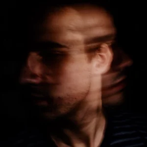 a blurry image of a man showing his face from several different angles