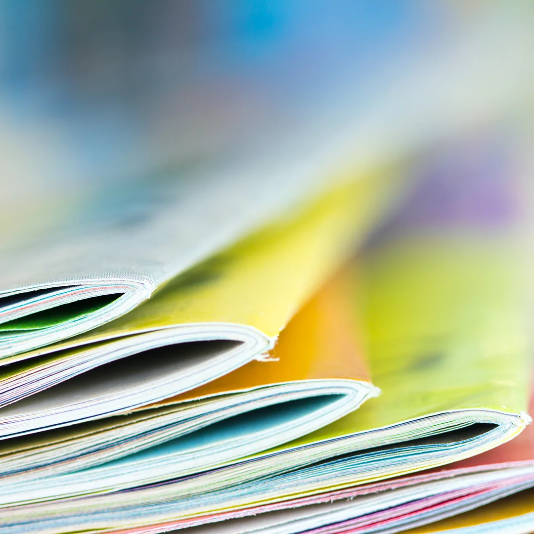 A stack of multicolored pamphlets