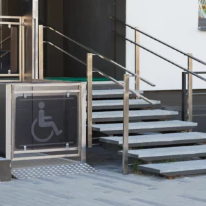 Stairs with a disability ramp next to it