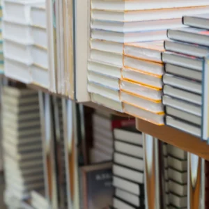 Textbooks stacked on shelves