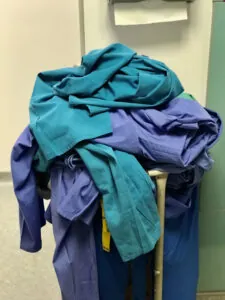 Medical scrubs piled high