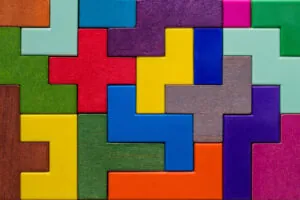 Background with different colorful shapes wooden blocks